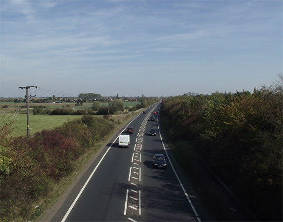 Looking east along Eye bypass in 2011. 60 years earlier you would have been watching trains going under the bridge.